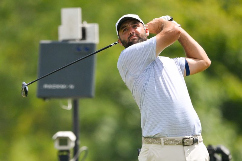 Scottie Scheffler plays his shot from the ninth tee during the third round of the FedEx St. Jude Championship.
