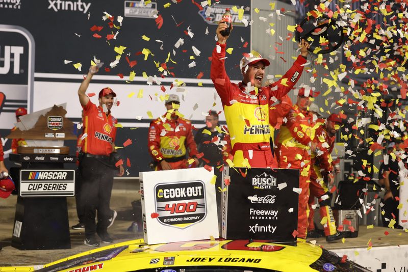 Team Penske driver Joey Logano (22) celebrates the win in the Cook Out 400 at Richmond Raceway.