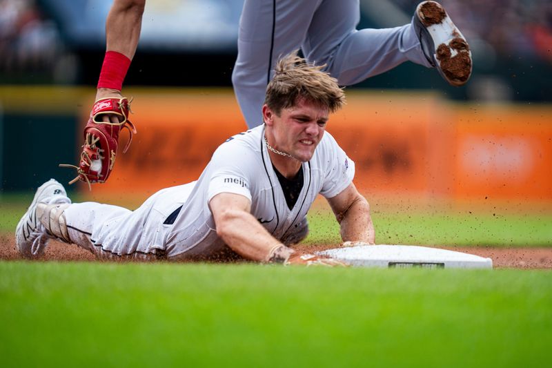Detroit Tigers left fielder Brett Callahan slides safe into third base after hitting a triple on a line drive in the second inning of a game against the Chicago White Sox at Comerica Park in Detroit on Sunday, Aug. 16, 2026.