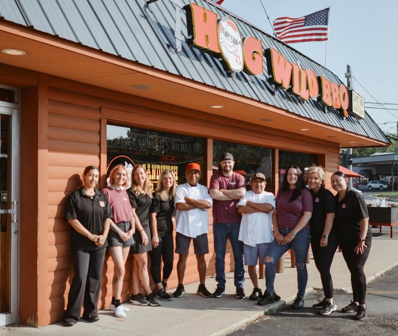 Jason VanderKlok (center) and two silent partners took over Hog Wild BBQ in March 2026.
