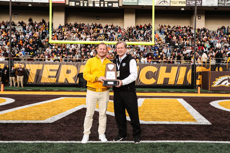 Western Michigan University athletic director Dan Bartholomae, left, stands with Mid-American Conference commissioner Jon Steinbrecher at a WMU home football game. Bartholomae was named Michigan State's next AD on Monday, Aug. 17.