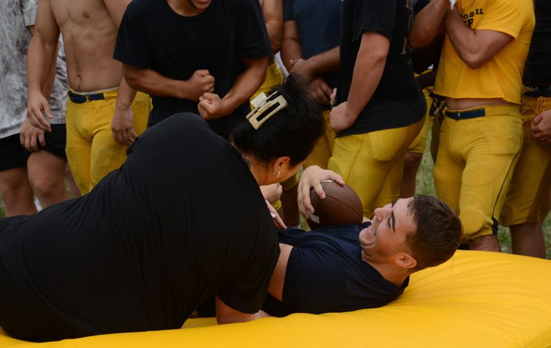 Gavin Falzon and his mother Sandra Falzon share a laugh during the Mom Mania event following an Airport training camp practice on Saturday, Aug. 15, 2026.