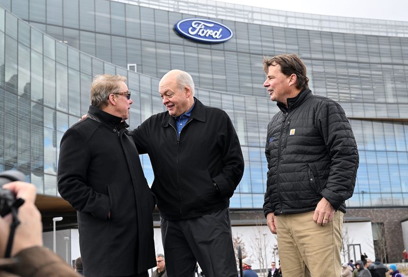 Jim Hackett (middle), shown here last November at an open house at the new Ford world headquarters in Dearborn, is the former CEO at the automaker, and also the former interim athletic director at Michigan.