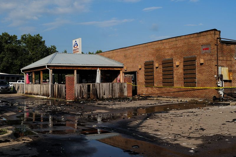 Remnants of a fire seen, Thursday, Aug. 20, 2026, at Gravity Smokehouse BB! on South Cedar Street in Delhi Township.