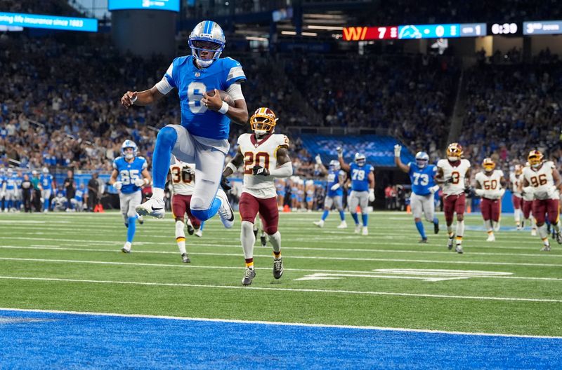 Detroit Lions quarterback Josh Dobbs runs in for a touchdown in the first quarter against the Washington Commanders at Ford Field in Detroit on Saturday, August 22, 2026.