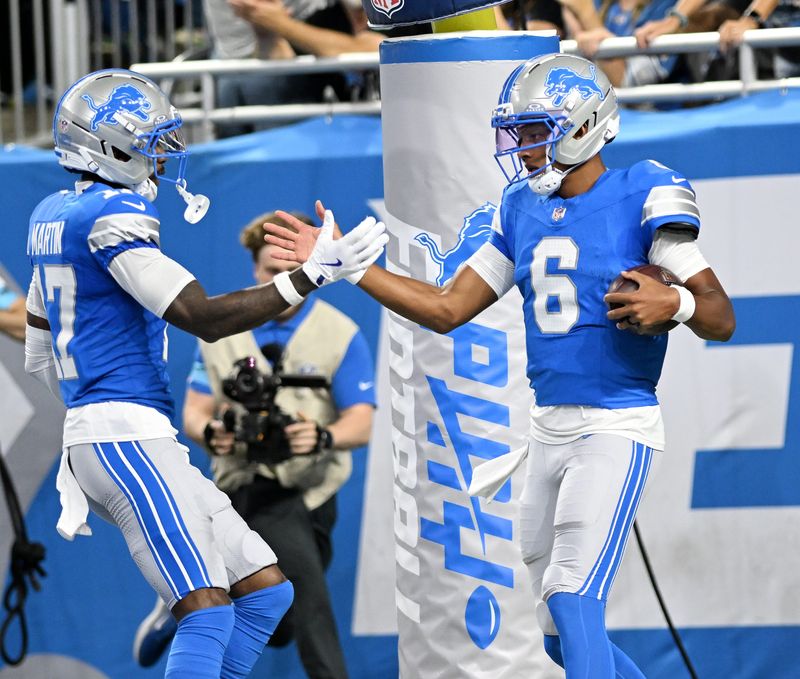 Lions’ Tay Martin congratulates quarterback Joshua Dobbs (6) after Dobbs’ touchdown in the first half.