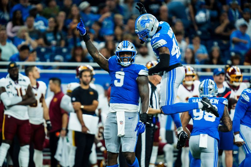 Detroit Lions defensive lineman Derrick Moore (9) and  defensive back Aamaris Brown (42) celebrate after a sack during the second quarter of a preseason game against the Washington Commanders at Ford Field in Detroit on Saturday, Aug. 22, 2026.