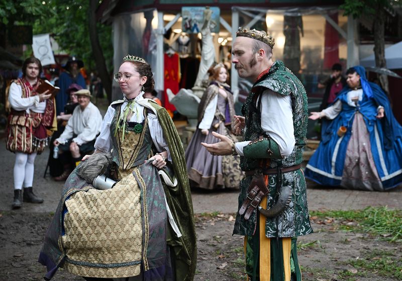 Characters perform the "Royal Court Fountain Tales" at the Arched Wall Fountain during the 2026 Michigan Renaissance Festival on August 22, 2026, in Holly, Mich