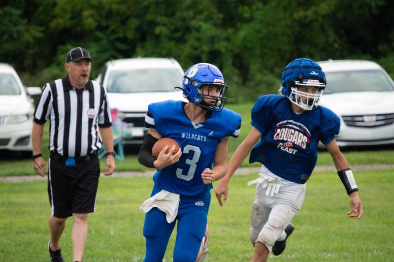 Pittsford senior quarterback Hunter Peiffer (3) picks off Lenawee Christian in scrimmage action.