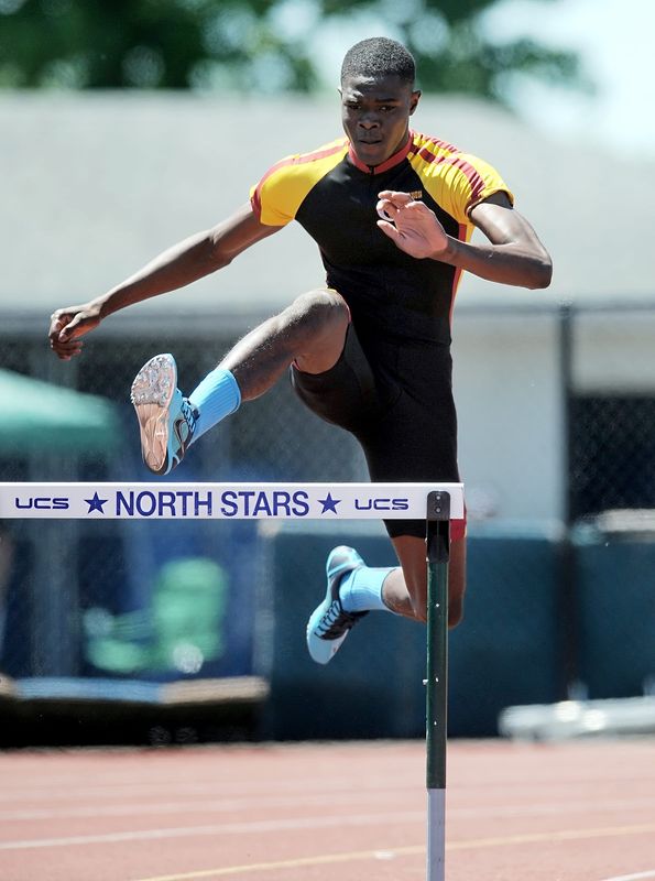 Mount Vernon's Rai Benjamin competes in the finals of the 400-meter hurdles during the NYSPHSAA Track & Field Championships held at Cicero-North Syracuse High School on Saturday, June 7, 2014.