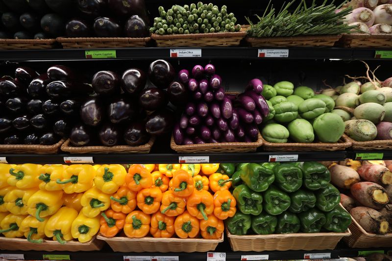 Whole Foods Market offers a variety of fruits and vegetables colorfully arranged.