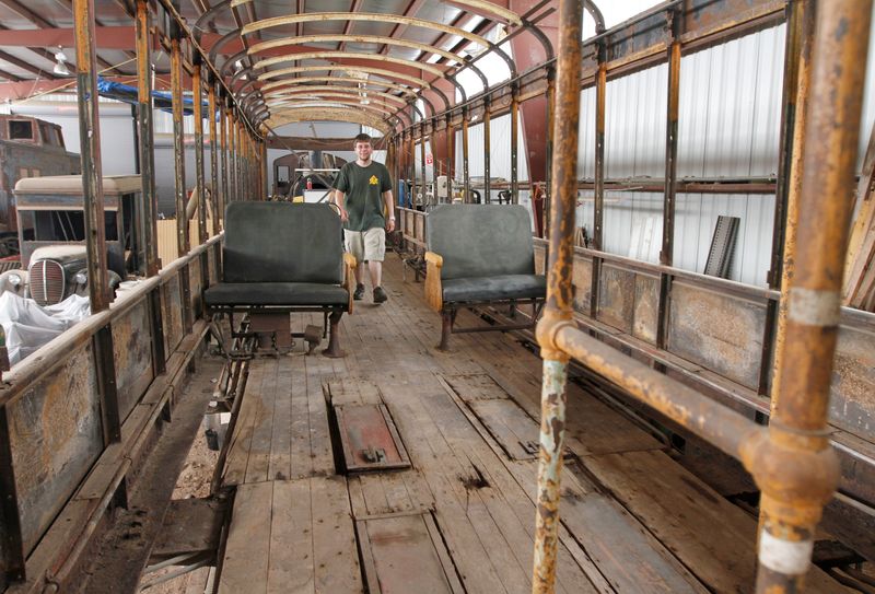 Joe Nugent, Medina, walks through the inside of Rochester Subway Car 60 in 2014. The two seats are originals to the car, which stopped operation in Rochester on June 30, 1956.