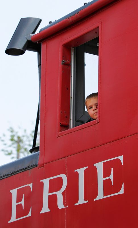 Joey Marzano, 3, peeks out the upper window of a Erie Railroad Caboose he and his family ride as they pull into the Rochester and Genesee Valley Railroad Museum in Rush in 2014.