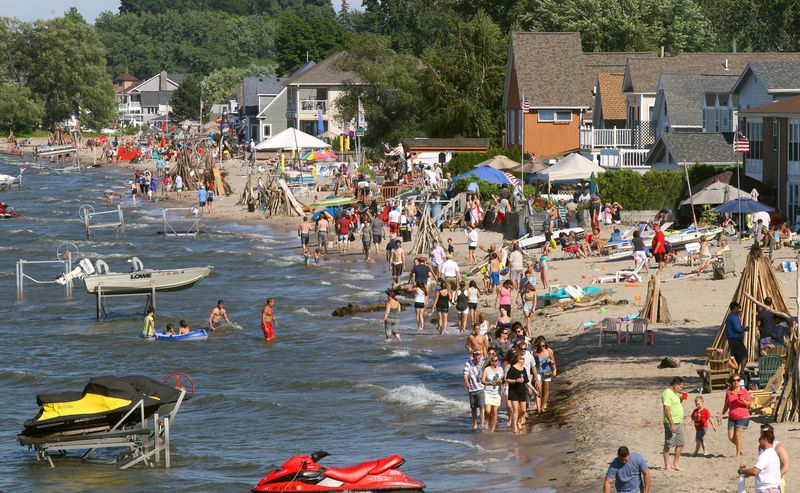 A view of part of the huge crowd at the July 4, 2014, party on Edgemere Drive along Lake Ontario in Greece. Families who live along the strip join together to throw the annual bash.