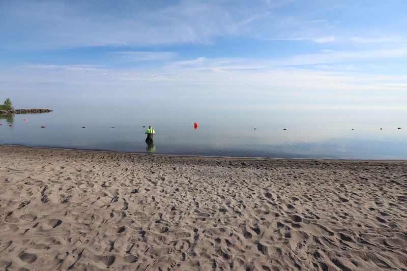 Terry Roegner, NYS park maintenance employee, tests the water quality at Hamlin Beach State Park.  He tests the water every Monday and Wednesday for E.coli.