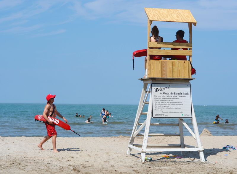 As summer temperatures climb, people make their way to Ontario Beach Park for fun in the sun.
