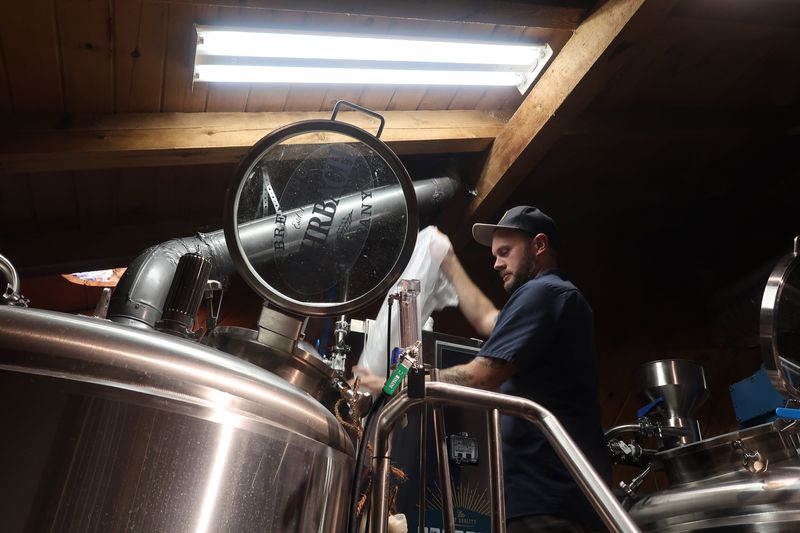 In this 2019 file photo, then Rohrbach Brewpub brewery manager Joel Will adds lactose to the The House of Silent Shadows Prohibition Porter, a collaboration between the brewery and Rochester's Little Theatre. Will is now poised to become president and chief operating officer of the company.