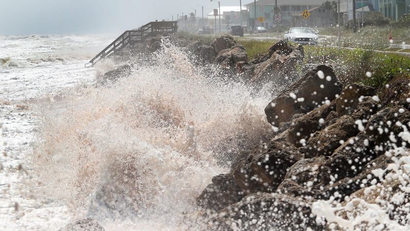 A big wave crashes against the dune along south A1A in Flagler Beach, near 13th street, Monday September 21, 2020 as a nor'easter pounds the coast.