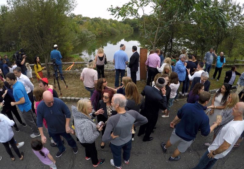 The annual Tashlich service at Camelot Lake in New City Sept. 27, 2019. People were invited to cast bread and stones into the Lake to ask forgiveness for sins of the past year.