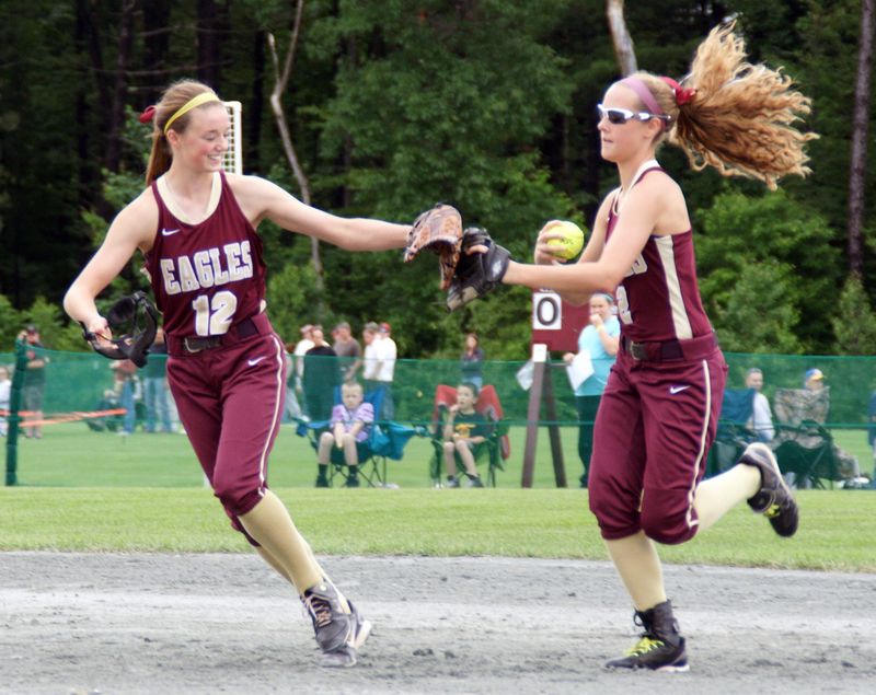 Wayland-Cohocton infielder Jessie Hammers (12) slaps gloves with Alyssa Recktenwald after getting out of an inning at the state tournament. Hammers is Section V's all-time leader in career batting average.