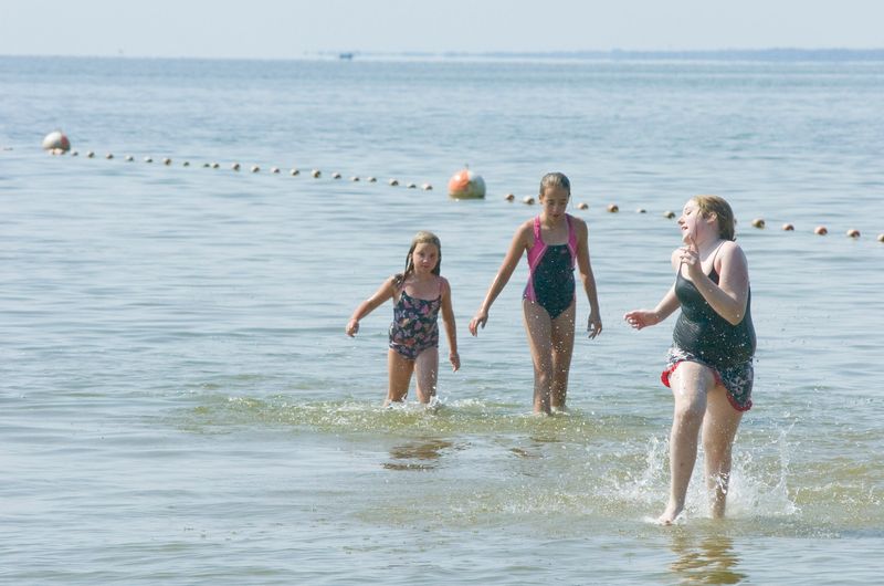 Left to right, Angelina Thomason, 6, Athena Thomason, 11, and Ragin Hewitt, 11, all of Syracuse, play in the water at Verona Beach State Park, Wednesday, September 2, 2009.