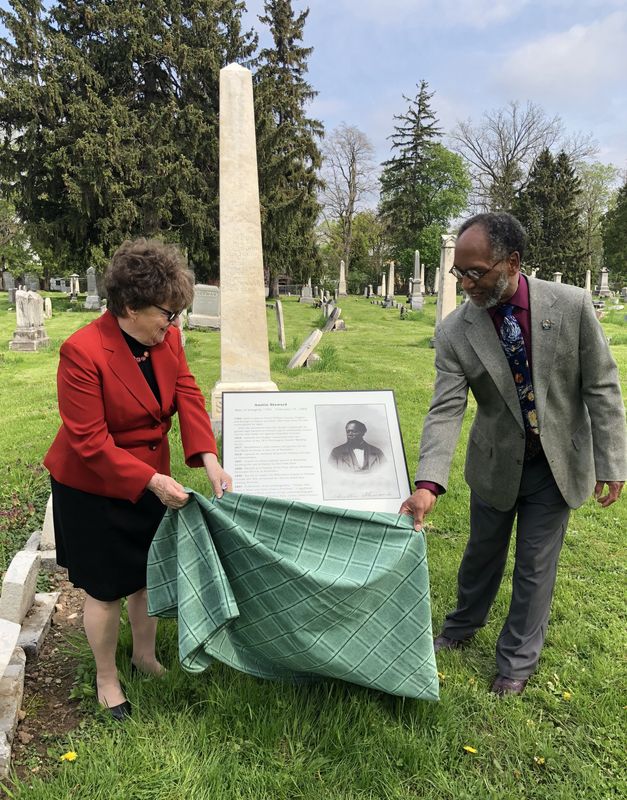 In this 2019 file photo, Canandaigua Mayor Ellen Polimeni and the Rev. Chester Freeman unveil a marker noting the accomplishments of abolitionist and author Austin Steward. The marker and his monument are in the West Avenue Cemetery.