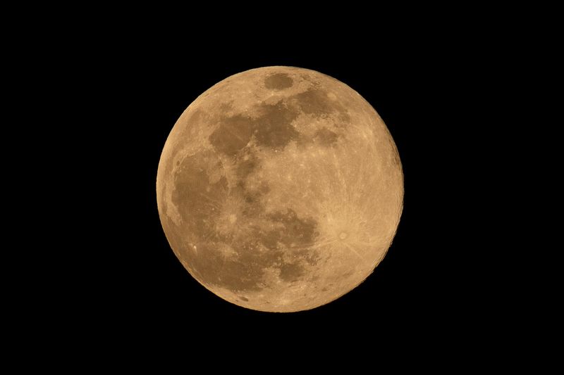 The "Super Pink Moon" is seen as it rises in the sky, Tuesday, April 7, 2020, in Hanover, Pennsylvania. April's full moon was the brightest and biggest full moon of 2020. A "pink moon" refers to a full moon that occurs in April, getting its name from pink wildflowers that bloom in April.