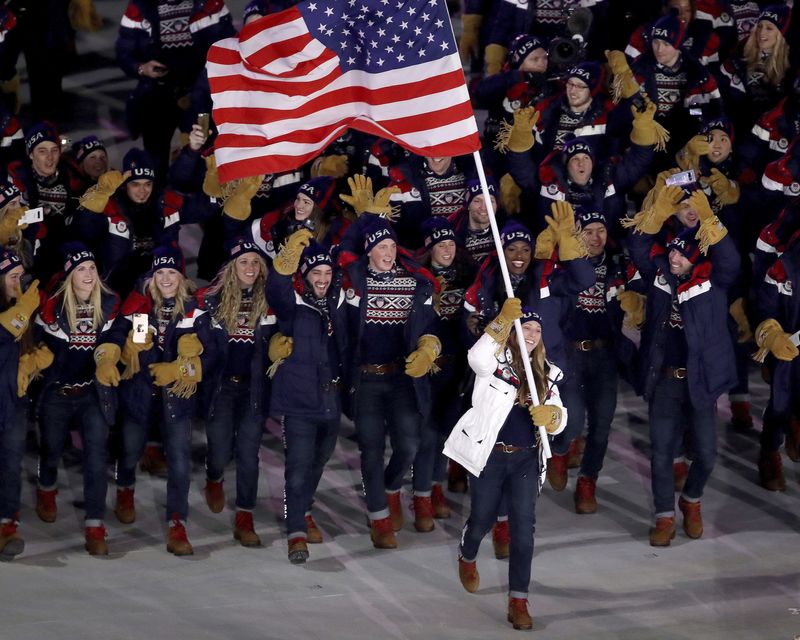 Erin Hamlin carries the flag of the United States during the opening ceremony of the 2018 Winter Olympics in Pyeongchang, South Korea, Friday, Feb. 9, 2018. (Sean Haffey/Pool Photo via AP)