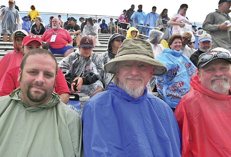 WATKINS GLEN, New York (08-14-2011) -- Fans cover up as rain postpones NASCAR, Heluva Good! Sour Cream Dips at the Glen. (Photo by Kristopher Radder)