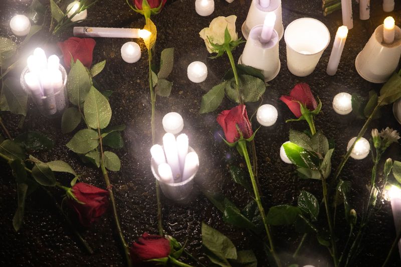 Candles and roses are placed at a memorial to remember Herman Graham III during a candlelit vigil in Marion County Courthouse in Salem, Oregon on Saturday, Nov. 14, 2020. Graham, 48, of Salem, was murdered on Oct. 26.