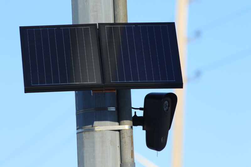 Flock Safety surveillance camera's as shown, use AI to identify license plate numbers, typically for locating lost or unsafe individuals sought by law enforcement.