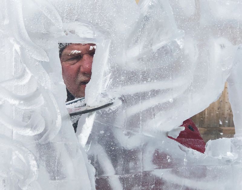 In this 2022 file photo, ice sculptor Jeff Bleier gets into his work during the Canandaigua Fire & Ice Festival, which will be held this year Feb. 21-22.