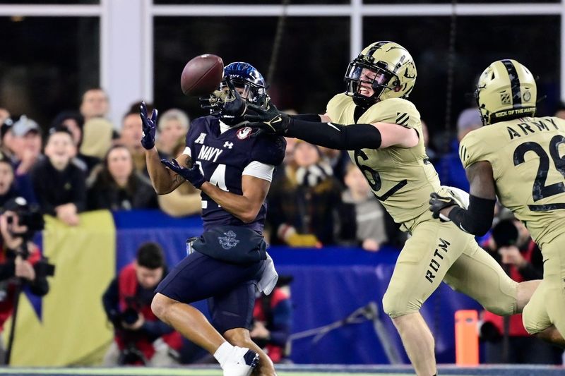 Army defensive back Max DiDomenico (6) breaks up a pass to Navy running back Brandon Chatman (24) during the second half at Gillette Stadium. Eric Canha-USA TODAY Sports