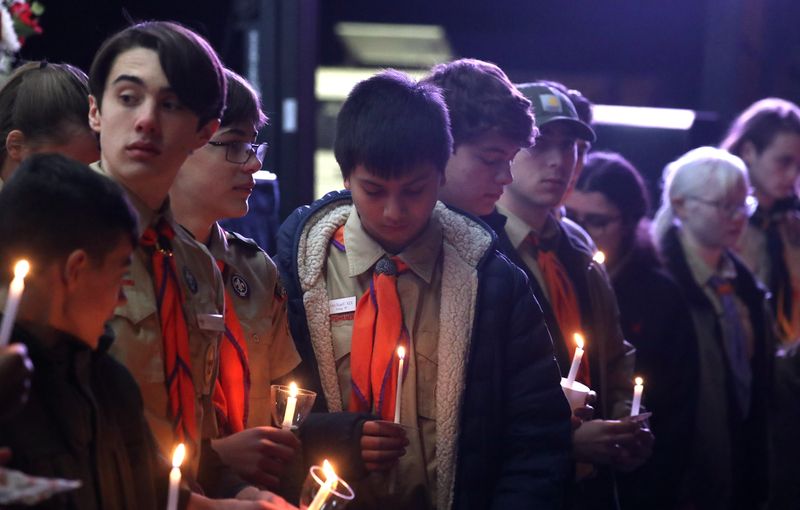 Boy Scouts attend a vigil for the Morgan family at Germonds Park in Bardonia Jan. 3, 2024. The husband/father, Bronxville Police Sgt. Watson Morgan, is believed to have killed his wife and two sons then shot himself in the family's New City home.