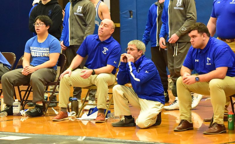 Horseheads head coach Brett Owen, left center, and assistant Troy Monks, right center, at the Section 4 Division I Dual Meet Wrestling Tournament on Jan. 17, 2023 at Horseheads. Horseheads beat Corning, 76-0, and Elmira topped Ithaca, 46-27, in the semifinals. Horseheads beat Elmira, 51-14, for the title.