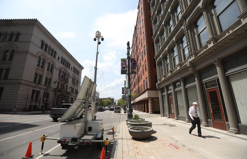 A portable police camera is set up in front of the Powers Building facing the Monroe County Government Office. The camera was set up because the county is concerned about protests at a legislature meeting.