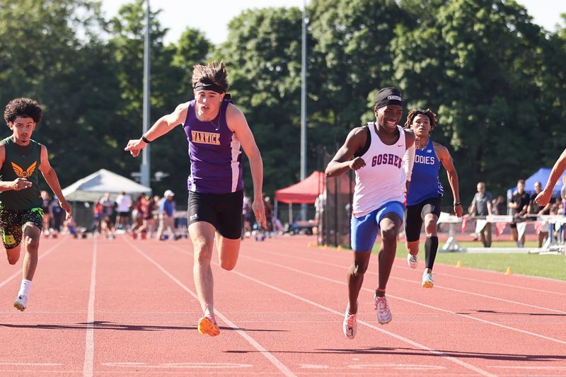 Warwick's Luke Beattie, left is beaten by 1/100th of a second by Goshen's Dametrious Esannason, right, in the Division 1 boys 100-meter dash at the Section 9 state qualifier in Goshen, NY on May 31, 2024.
