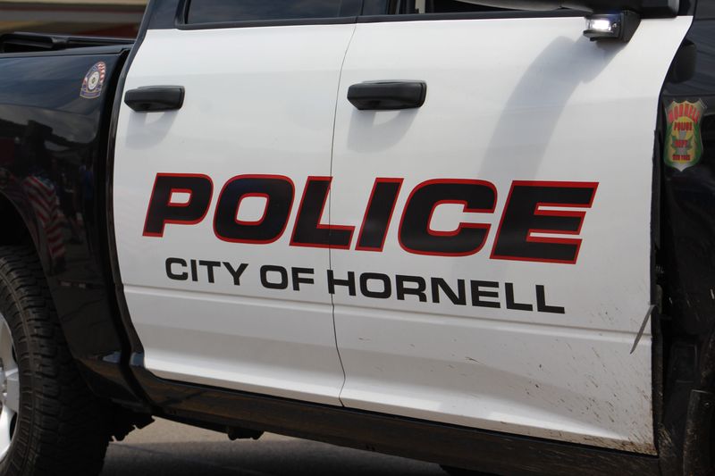 A City of Hornell Police Department vehicle travels along Main Street.