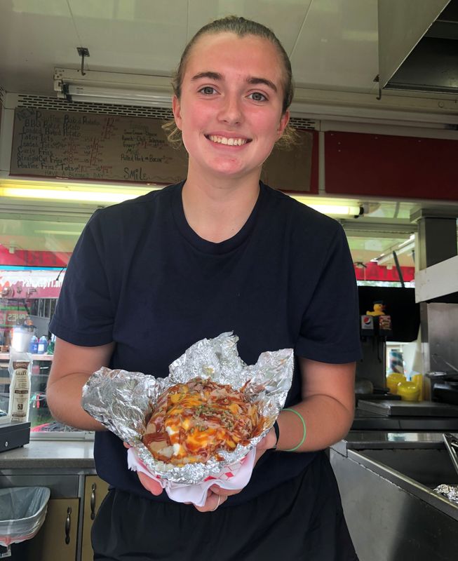 A Carolina park barbecue baked potato is available at the Oberst Concession at the Midway of the Allegany County Fair in Angelica.