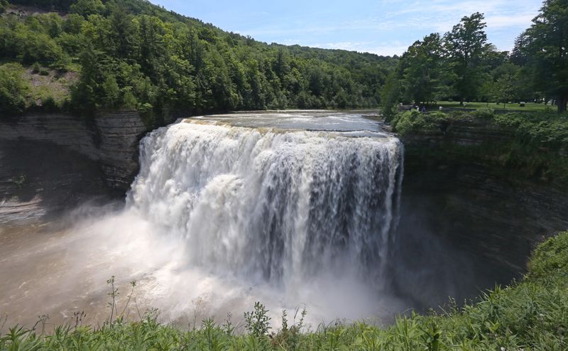 Waters of the Genesee River pour over the the iconic Middle Falls in the South End at Letchworth State Park.