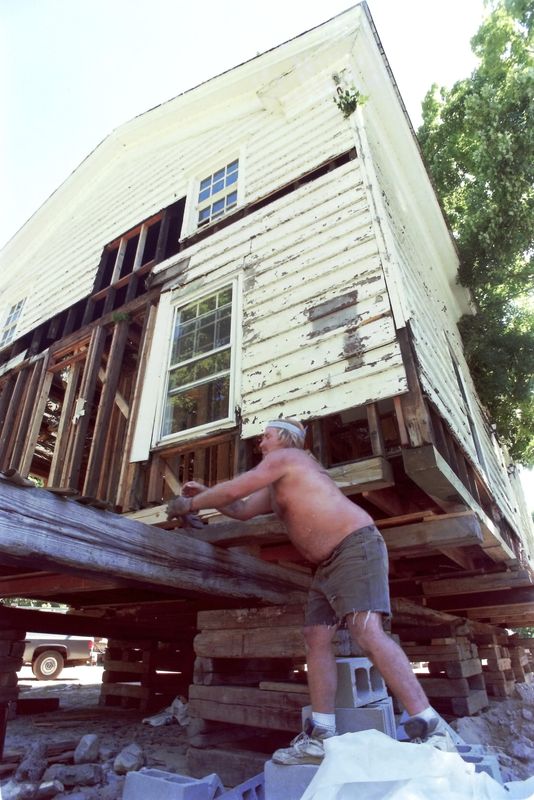 Workers from Davis Brothers Building Movers gently work to move a building once owned by the Lobdell family to a new location on Titicus Road in North Salem August 30, 1995. The building, once known as the Lobdell store, was built in 1848, and is now designated a historic landmark used by the town of North Salem.