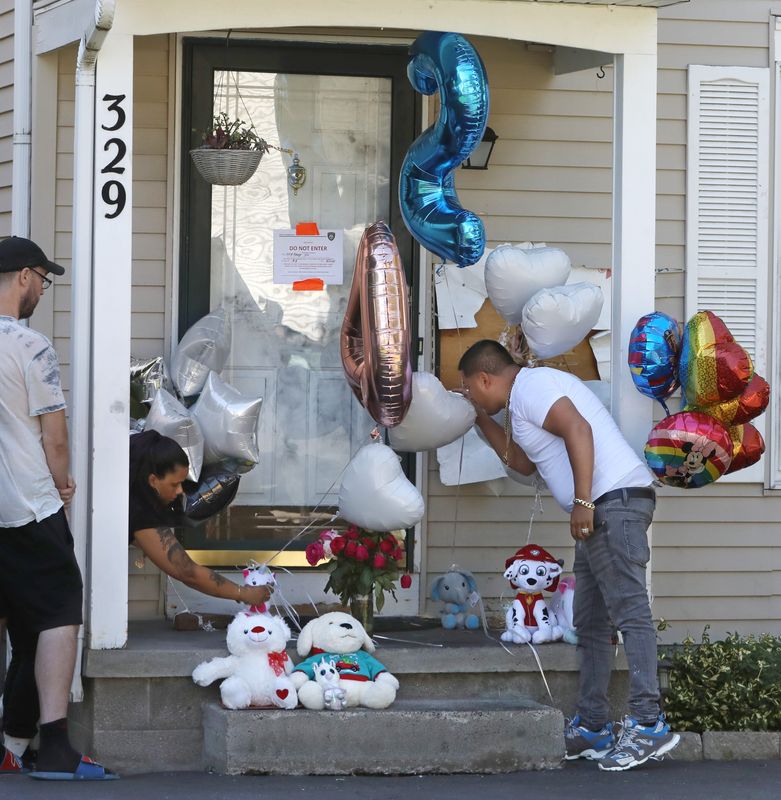 Friends and family members leave balloons and stuffed animals at the scene of a four person homicide at 329 Knapp Ave in Irondequoit Monday, Sept. 2, 2024.