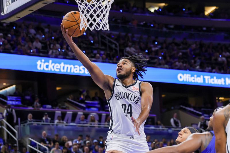 Oct 25, 2024; Orlando, Florida, USA; Brooklyn Nets guard Cam Thomas (24) goes to the basket during the second quarter against the Orlando Magic at Kia Center. Mandatory Credit: Mike Watters-Imagn Images