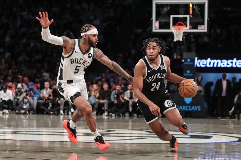 Oct 27, 2024; Brooklyn, New York, USA; Brooklyn Nets guard Cam Thomas (24) drives past Milwaukee Bucks guard Gary Trent Jr. (5) in the fourth quarter at Barclays Center. Mandatory Credit: Wendell Cruz-Imagn Images