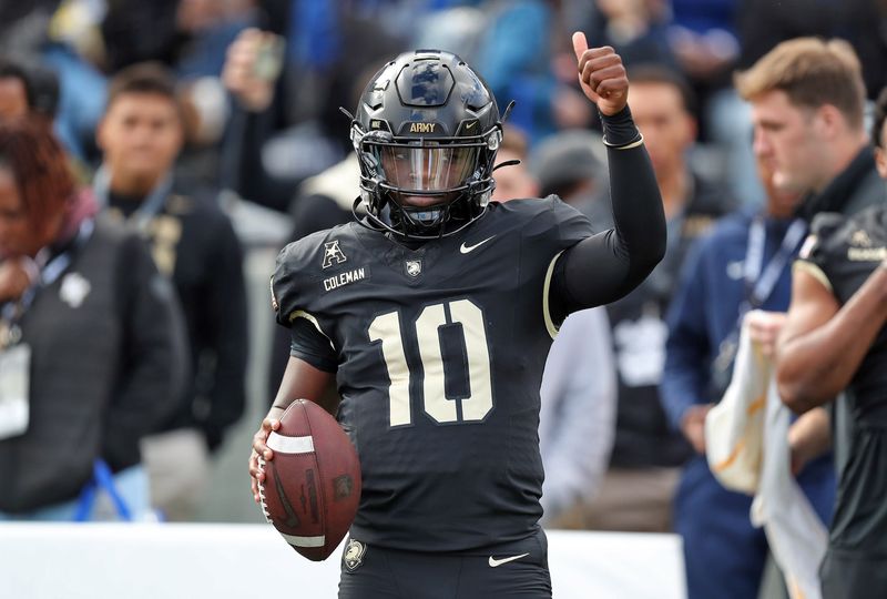 Nov 2, 2024; West Point, New York, USA; Army Black Knights quarterback Dewayne Coleman (10) arms up before the first half against the Air Force Falcons at Michie Stadium. Mandatory Credit: Danny Wild-Imagn Images
