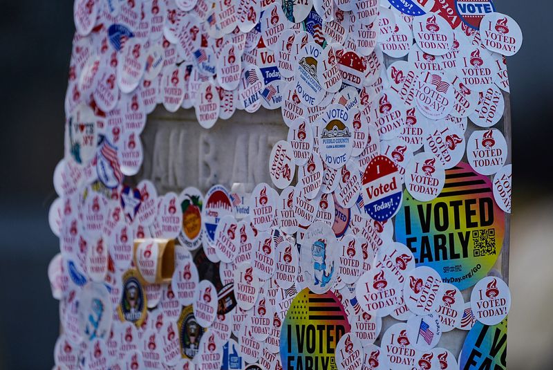 The tombstones of Susan B. Anthony and her sister, Mary, at Mt. Hope Cemetery in Rochester, NY on Nov. 5, 2024 were covered with I voted stickers, some from other states.