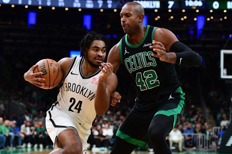 Nov 8, 2024; Boston, Massachusetts, USA; Brooklyn Nets guard Cam Thomas (24) controls the ball while Boston Celtics center Al Horford (42) defends during the first half at TD Garden. Mandatory Credit: Bob DeChiara-Imagn Images