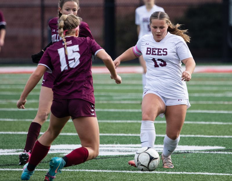 Byron-Bergen's Elizabeth Starowitz advances the ball.