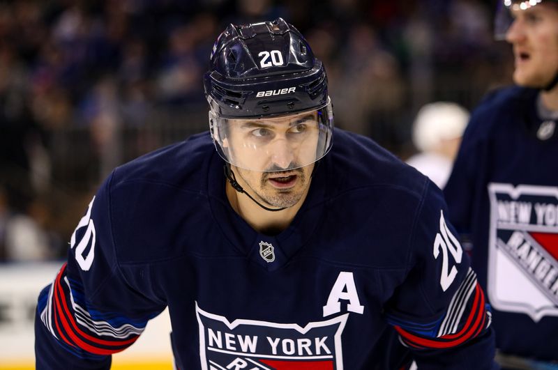 Nov 3, 2024; New York, New York, USA; New York Rangers left wing Chris Kreider (20) skates against the New York Islanders during the third period at Madison Square Garden.