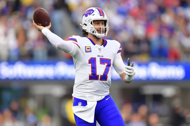 Dec 8, 2024; Inglewood, California, USA; Buffalo Bills quarterback Josh Allen (17) throws against the Los Angeles Rams during the first half at SoFi Stadium. Mandatory Credit: Gary A. Vasquez-Imagn Images